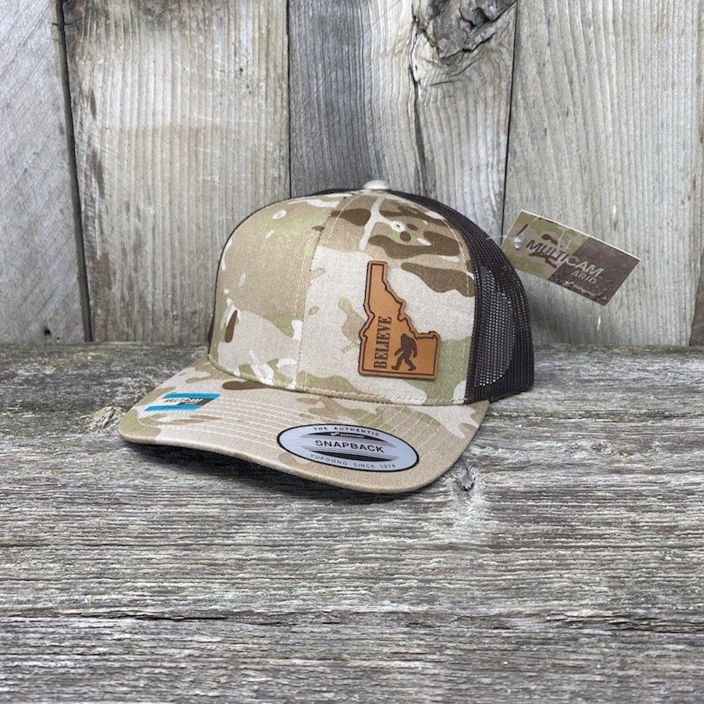 BIGFOOT IDAHO LEATHER PATCH HAT FLEXFIT Leather Patch Hats Hells Canyon Designs # Arid/Brown Multi-cam